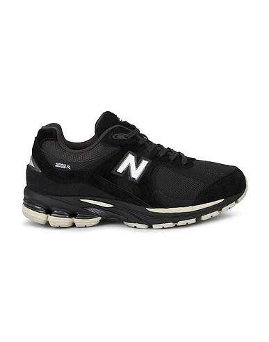 New Balance 2002r Sneaker in Black - size Mens 11/Womens 12.5