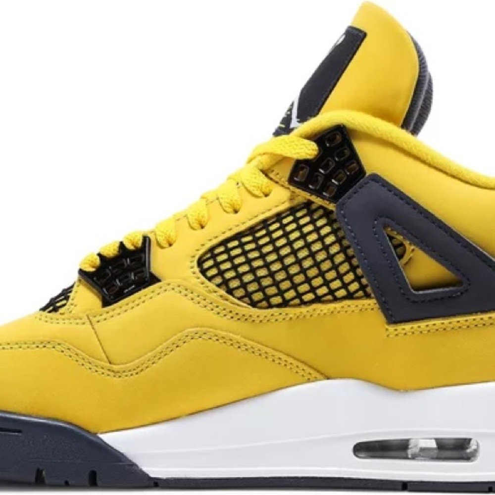 Yellow and black Jordan 4s