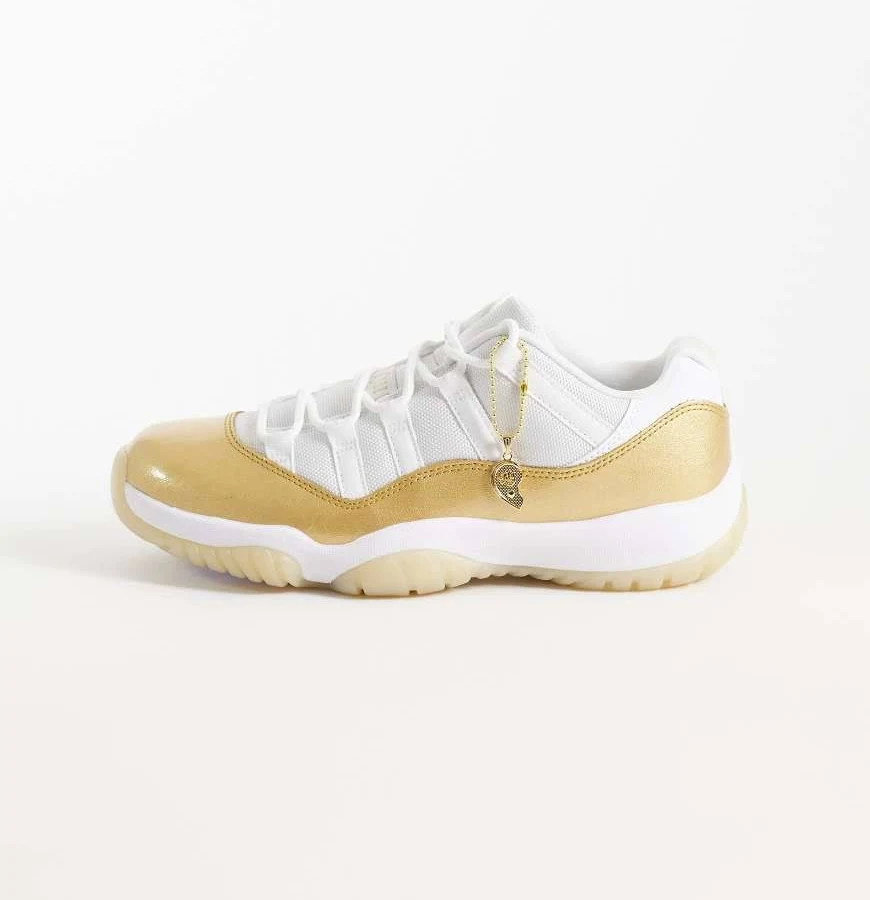 Nike Air Jordan 11 Retro Low sneakers in white and gold