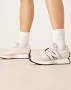 New Balance 327 sneakers in light pink with cream detail