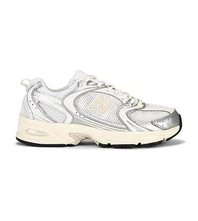 New Balance 530 Sneaker in Metallic Silver - size Mens 9.5/Womens 11