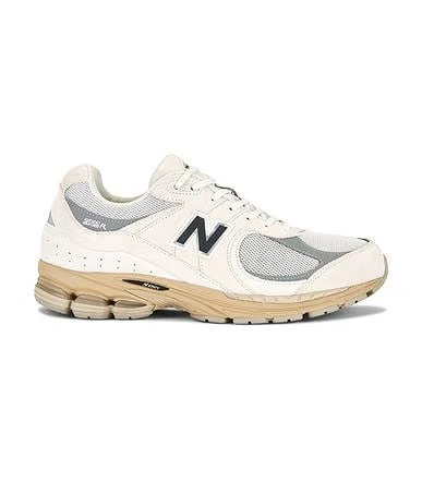 New Balance 2002r Sneaker in White - size Mens 9/Womens 10.5