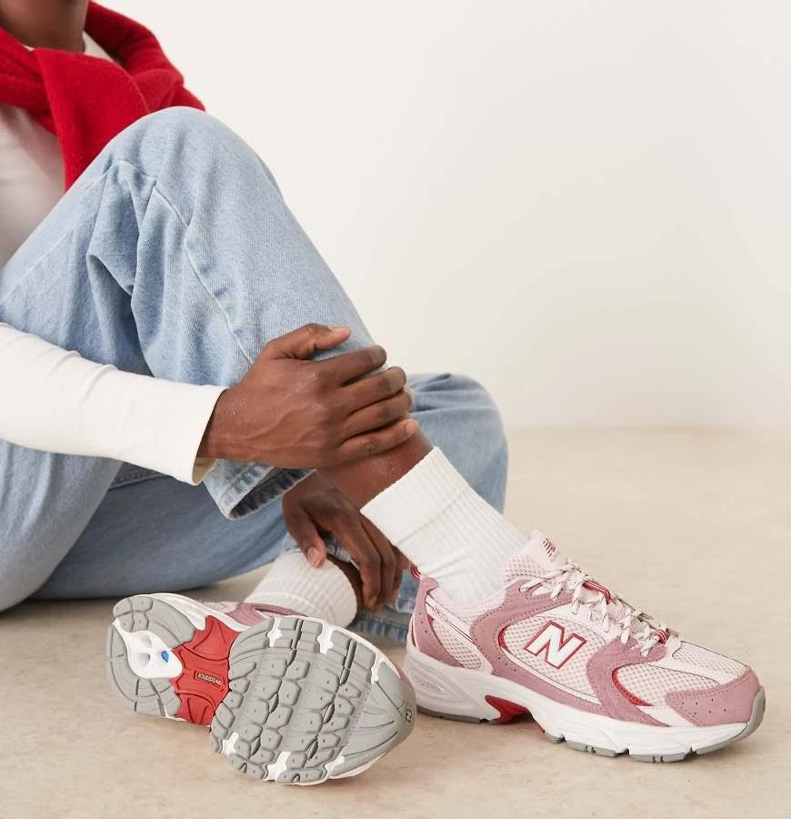 New Balance 530 sneakers in pink and red