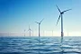 Offshore wind farm with turbines standing in serene sea Poster